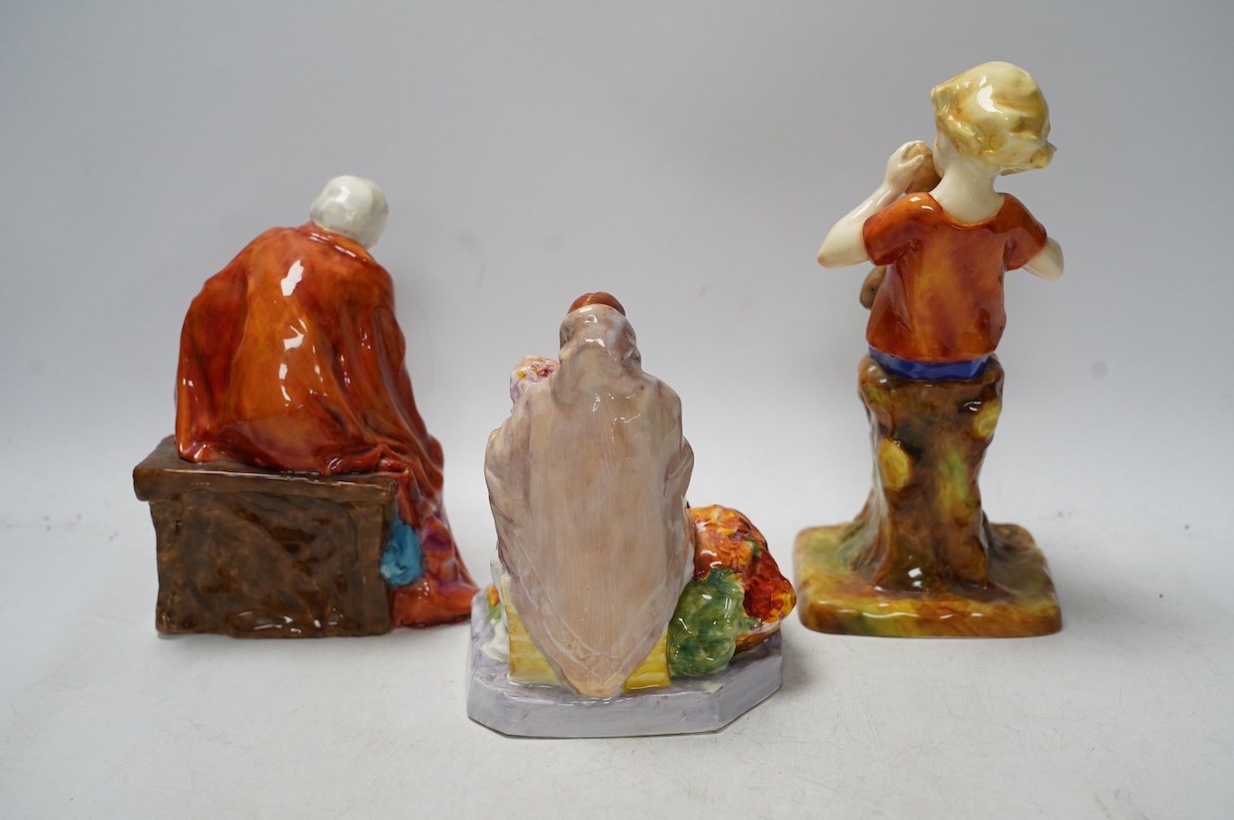 Three Worcester figurines comprising 'Dublin Flower Girl', The Fortune Teller and Peter Pan, tallest 20cm high. Condition - good